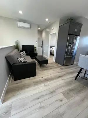 a living room with a couch and a refrigerator at Vacation home in Westminster