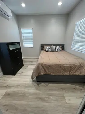 a bedroom with a bed and a dresser in it at Vacation home in Westminster