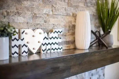 a shelf with hearts and vases and a brick wall at Amazing Escape near LA Meditation Room, Game room, Hot Tub, Pool in Leona Valley