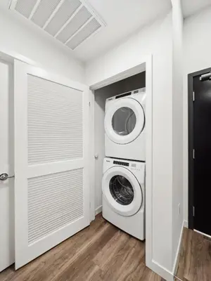 a laundry room with a washer and dryer at Spacious 1BDR near Walk of Fame with Luxury Amenities in Los Angeles