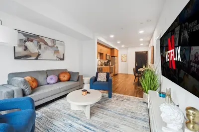 a living room with a couch and a table at Spacious 1BDR near Walk of Fame with Luxury Amenities in Los Angeles