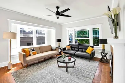 a living room with a couch and a table at Charming Craftsman Near DTLA in Los Angeles