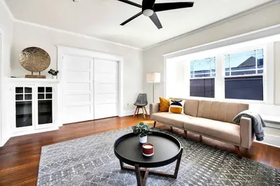 a living room with a couch and a table at Charming Craftsman Near DTLA in Los Angeles