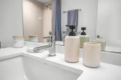 a bathroom sink with two rolls of toilet paper on it at The Sky Gem in Los Angeles