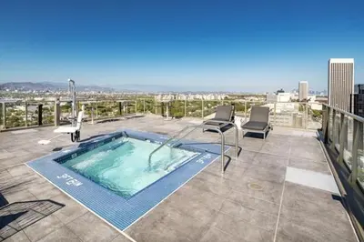 a swimming pool on the roof of a building at The Sky Gem in Los Angeles