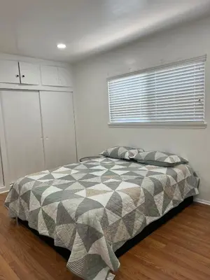 a bedroom with a bed and a window in it at Sunny Franklin Place in Los Angeles