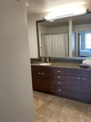 a bathroom with a sink and a large mirror at Villa Marina - AMAZING Modern, Spacious, Stylish 2 Master Suites in CENTRAL Marina Del Rey in Los Angeles
