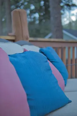 a pile of pillows sitting on a porch at Ray's Dear Cottage in Wrightwood