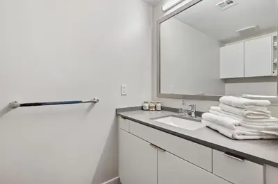 a bathroom with a sink and a mirror at Hollywood 1bdr Comfort with Pool, Gym, Free Parking in Los Angeles