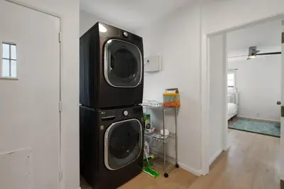 a room with a washer and dryer at Spacious 4BR House with Large Yard and Parking Beverly Hills Adj in Los Angeles