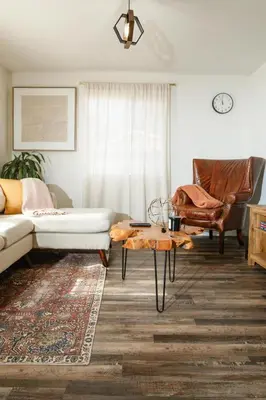 a living room with a couch and a coffee table at Central Modern All-In-One Home in Lakewood