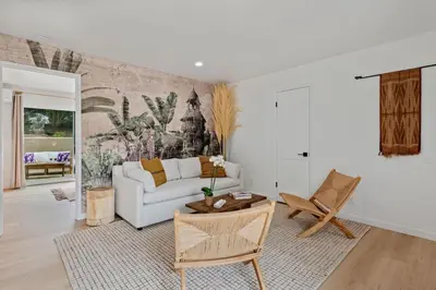 a living room with a couch and a table at Seaside and Newly Renovated in Summerland
