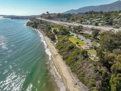 an aerial view of a beach and a highway at Private Garden and Family Friendly in Summerland