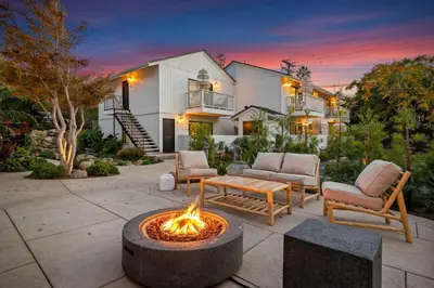 a backyard with a fire pit in front of a house at Private Garden and Family Friendly in Summerland
