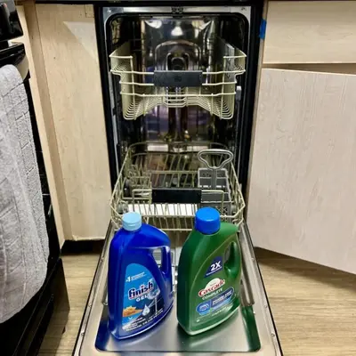 a dishwasher with two bottles of laundry detergent at Serenity Retreat in Santa Monica in Los Angeles