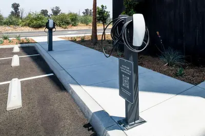 a street light next to a parking lot with a parking meter at Courtyard by Marriott San Bernardino Loma Linda in Loma Linda