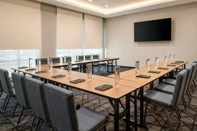 a large conference room with a long table and chairs at Courtyard by Marriott San Bernardino Loma Linda in Loma Linda