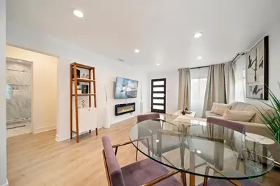 a living room with a glass table and a couch at Hidden South Bay Gem near Manhattan and Redondo Beach in Redondo Beach