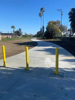 a sidewalk with yellow posts in the middle of a road at BonVoyage-Sleep&Sail Overnight Stays-Sleeps 6-8 in Long Beach