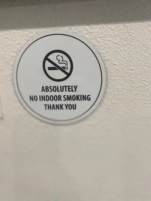 a sign on a ceiling with a no indoor smoking sign at BonVoyage-Sleep&Sail Overnight Stays-Sleeps 6-8 in Long Beach