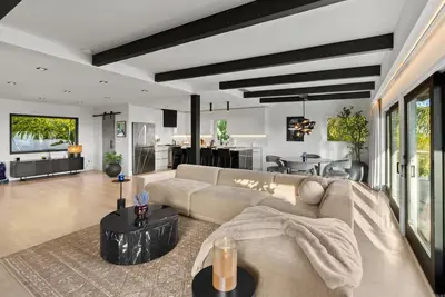 a living room with a couch and a table at Hollywood Hills 3 Bedroom Views and Jacuzzi in Los Angeles