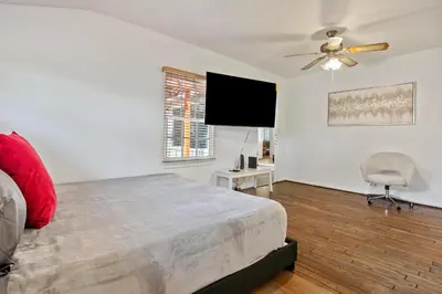a bedroom with a bed and a ceiling fan at Modern piano Los Angeles home by universal studio & Hollywood for 10 in Studio City