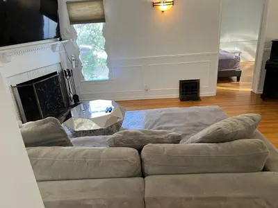 a living room with a couch and a fireplace at Modern 4bed 3bath home with piano near Universal Studio & Hollywood for 10 in Studio City