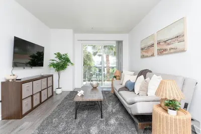 a living room with a couch and a table at Hollywood Cozy Apartment in Los Angeles