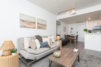 a living room with a couch and a table at Hollywood Cozy Apartment in Los Angeles