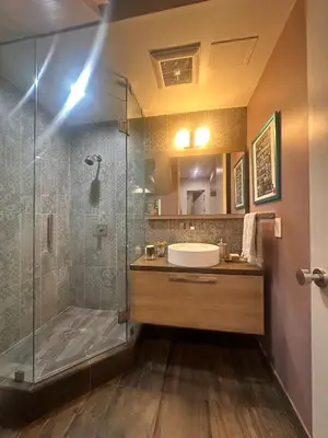 a bathroom with a sink and a shower at Luxury Living in West Hollywood Modern 3BR Home w Pool & Hot tub in Los Angeles