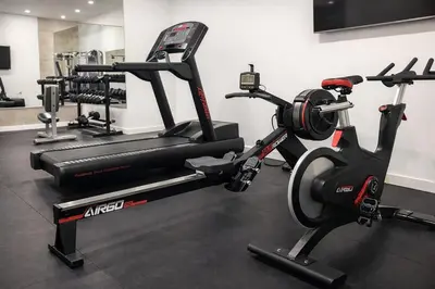 a gym with two exercise bikes in a room at Designer 1 Bedroom Condo in Prime Hollywood in Los Angeles