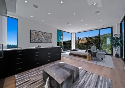 a living room with large windows and a couch at Ocean to City Views, Fire Feature, Water falls Dream Oasis in Los Angeles