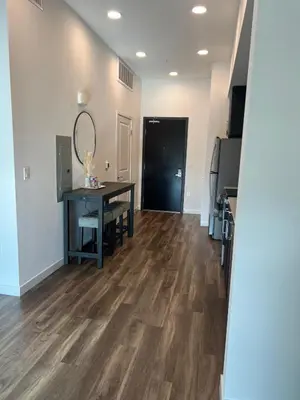 a dining room with a table and a mirror at The sunset loft apartment FREE parking in Los Angeles