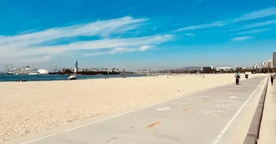 a beach with a person riding a motorcycle on the sand at Ocean View Suite by Convention Center & Beach in Long Beach