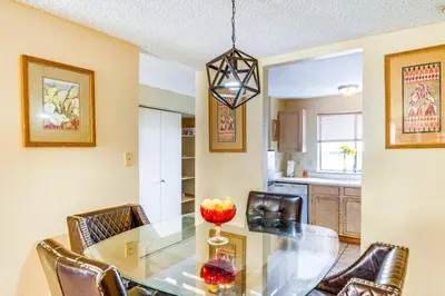 a dining room with a glass table and chairs at Patio and Mtn Views Family Gem in California City in California City