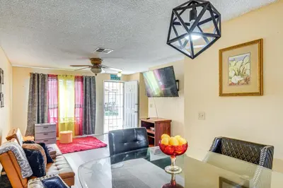 a living room with a table and a dining room at Patio and Mtn Views Family Gem in California City in California City