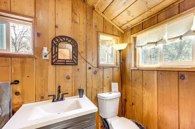 a bathroom with a toilet and a sink at Tiny Home with Deck and Mtn Views in Lake Arrowhead! in Lake Arrowhead