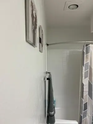 a bathroom with a shower with a green towel at Starlight Studio near Sunset in Los Angeles