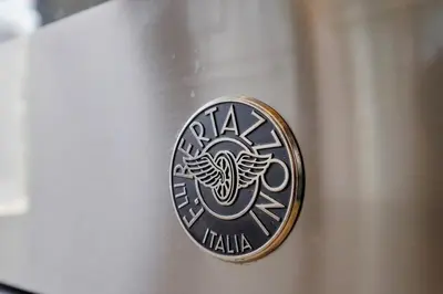 a emblem on the side of a silver car at Malibu Beach House by Stay Awhile Villas in Malibu
