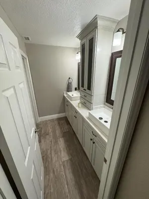 a bathroom with two sinks and a mirror at Riverside Views & Pool Retreat in Riverside