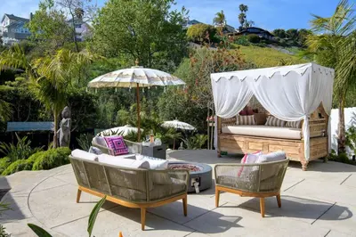 a patio with a gazebo and two chairs and an umbrella at Private Balcony and Coastal Escape in Summerland