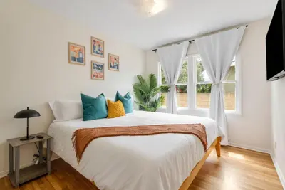 a bedroom with a bed and a window at Vintage Vibes Near Airport Games Sleeps 8 in Long Beach