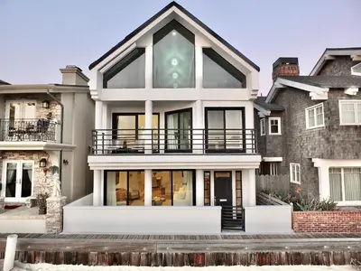an image of a house with a large window at Beachfront Estate - LB Peninsula in Long Beach
