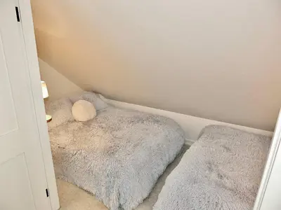 a small room with a dog bed in the corner at Beachfront Estate - LB Peninsula in Long Beach
