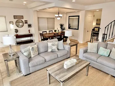 a living room with a couch and a table at Beauty by the Beach - SoCal Fun in Long Beach