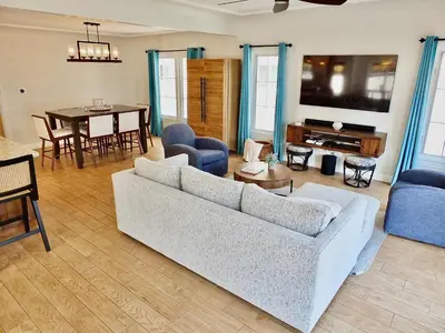 a living room with a couch and a table at Belmont Shore Beach House - Incredible Oceanfront Views in Long Beach