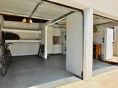 an open garage with a bike in a room at Belmont Shore Beach House - Incredible Oceanfront Views in Long Beach