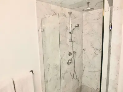 a shower with a glass door in a bathroom at Steps to Beach & Alamitos Bay on LB Peninsula in Long Beach