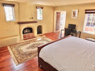 a bedroom with a bed and a fireplace at La Brisa - One Block from the Beach in Long Beach