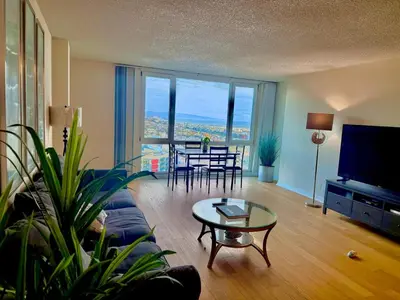 a living room with a couch and a table at Luxury Meets Sea of Dreams in Los Angeles